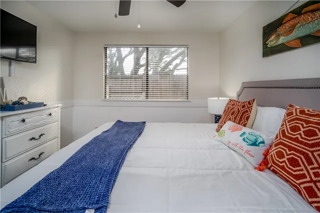 a living room with a couch and a flat screen tv