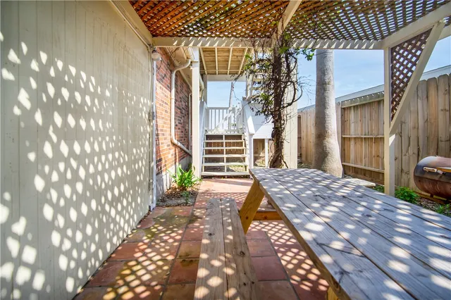 a view of a balcony with furniture