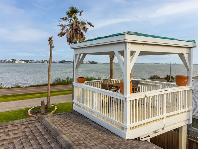 a view of a porch with a floor to ceiling window