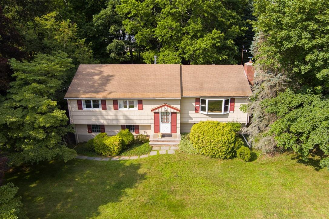 a view of a house with pool and a garden