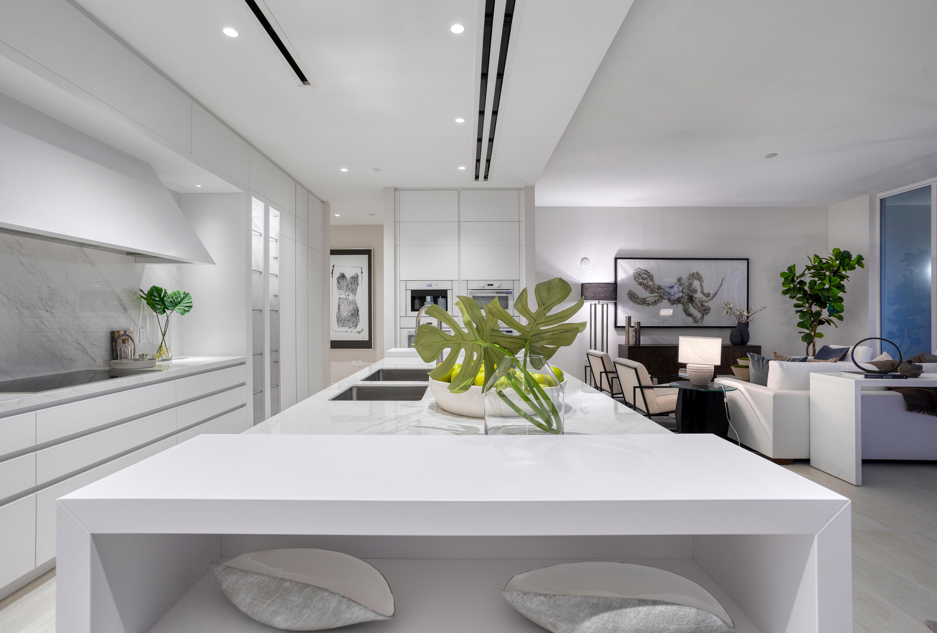 200 Southeast Mizner Boulevard, Unit PH18 Boca Raton, FL 33432 - Photo 22 of 49 a living room with furniture and potted plant