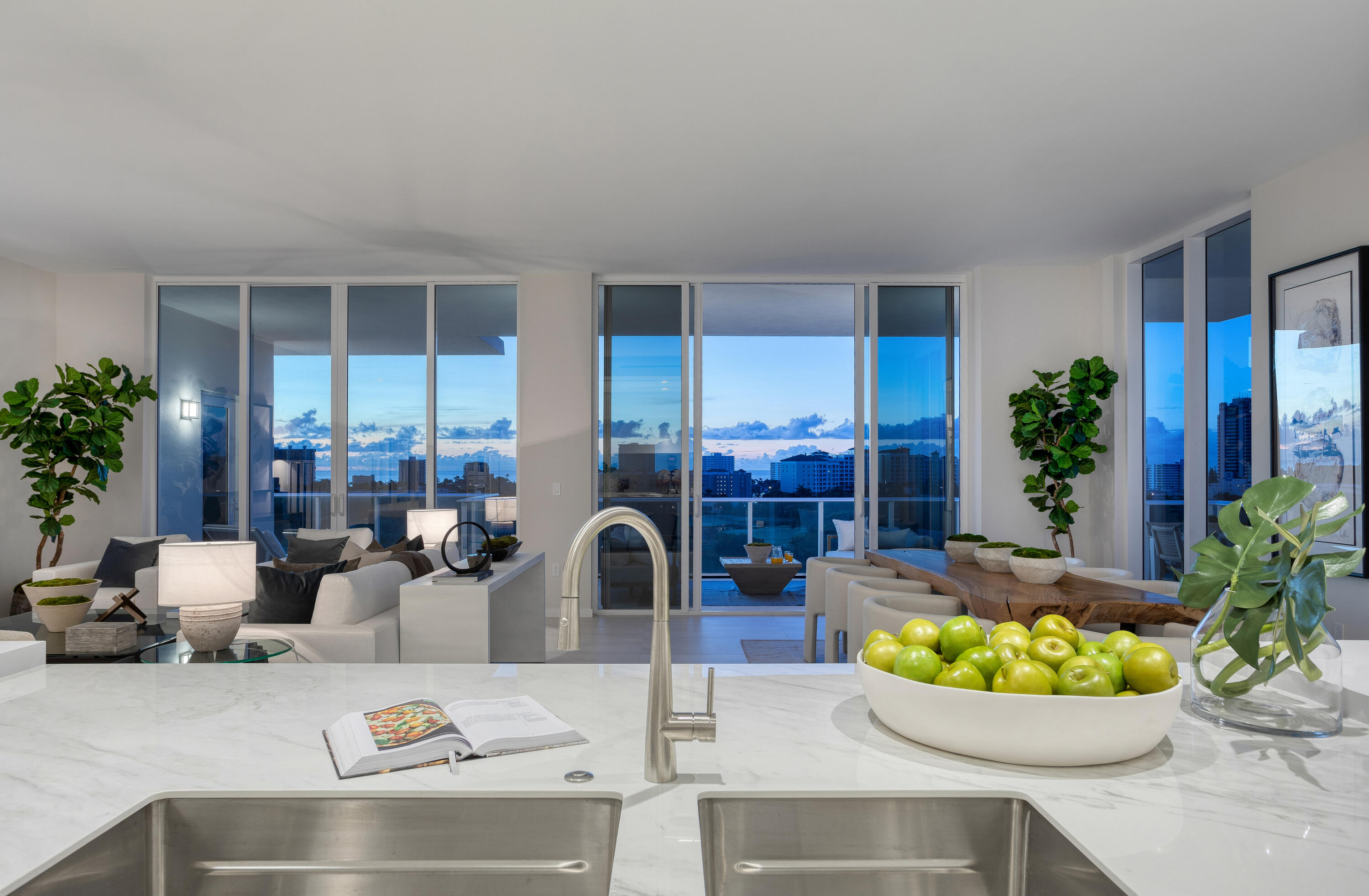 200 Southeast Mizner Boulevard, Unit PH18 Boca Raton, FL 33432 - Photo 23 of 49 a living room with furniture and flowers