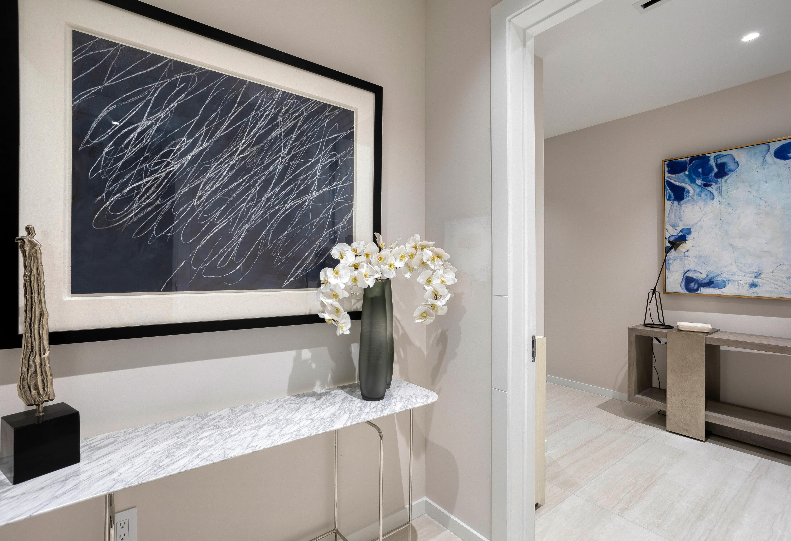 200 Southeast Mizner Boulevard, Unit PH18 Boca Raton, FL 33432 - Photo 29 of 49 a vase of flowers sitting on a table