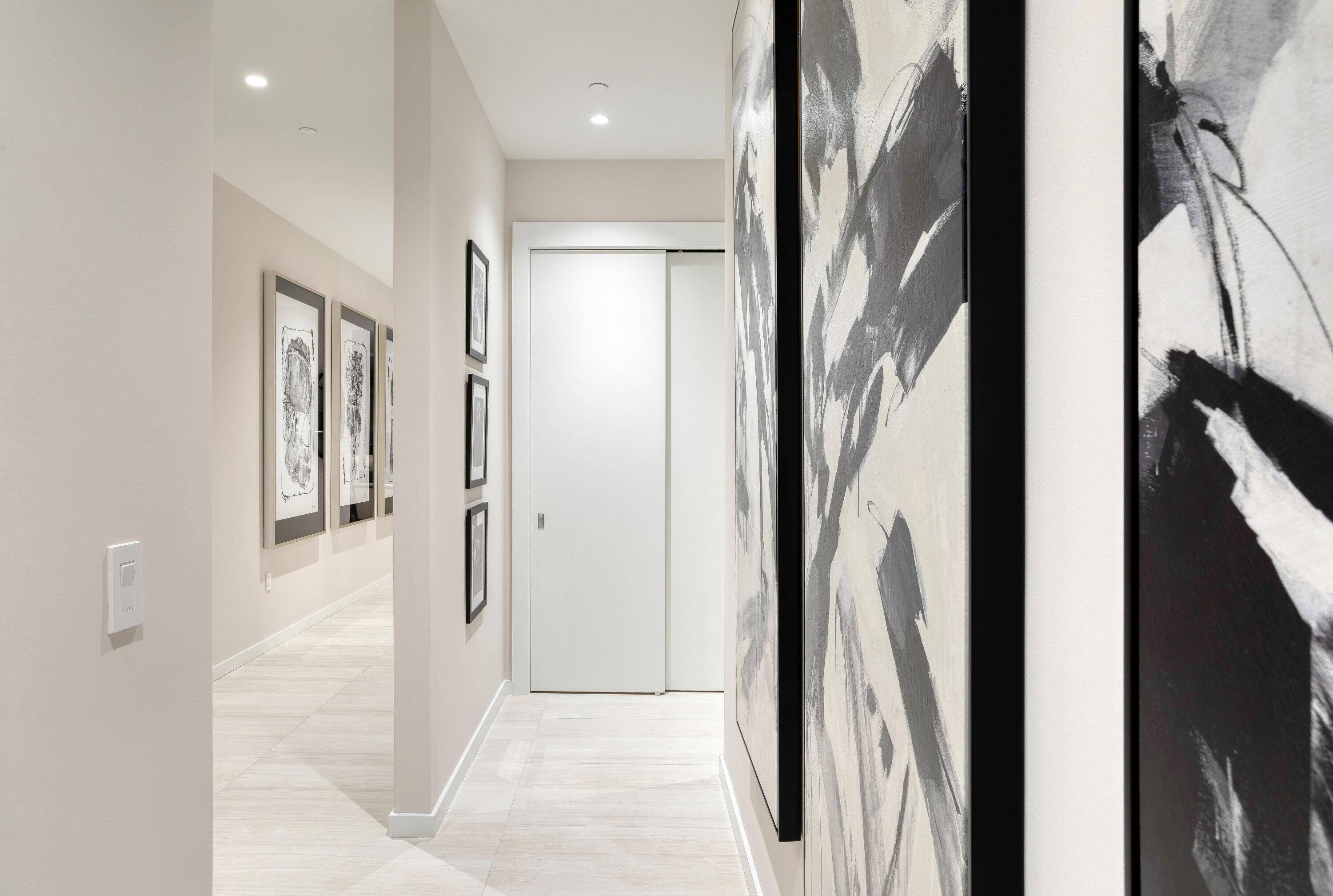 200 Southeast Mizner Boulevard, Unit PH18 Boca Raton, FL 33432 - Photo 30 of 49 a view of a hallway with wooden floor and a bathroom