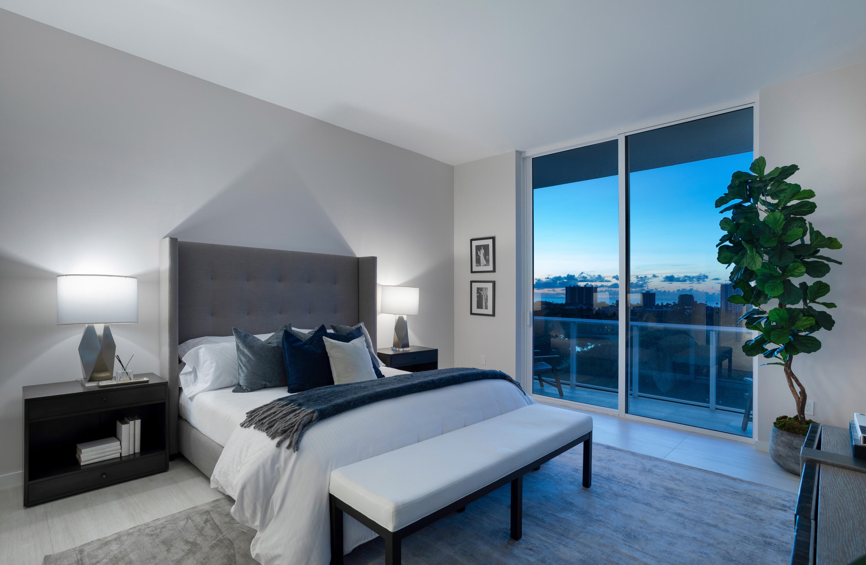 200 Southeast Mizner Boulevard, Unit PH18 Boca Raton, FL 33432 - Photo 33 of 49 a bedroom with a bed and a potted plant