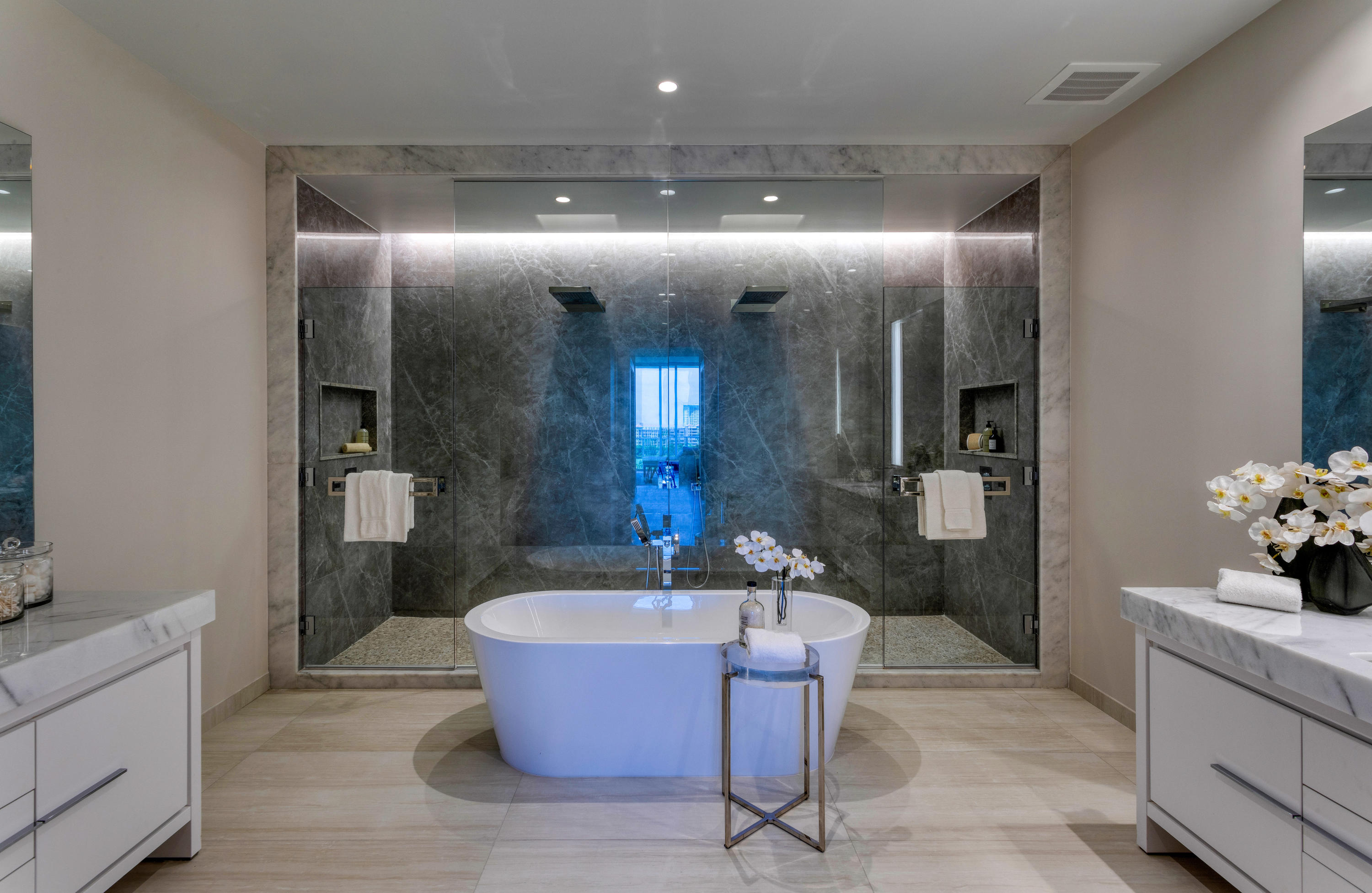 200 Southeast Mizner Boulevard, Unit PH18 Boca Raton, FL 33432 - Photo 34 of 49 a spacious bathroom with a tub a sink and mirror