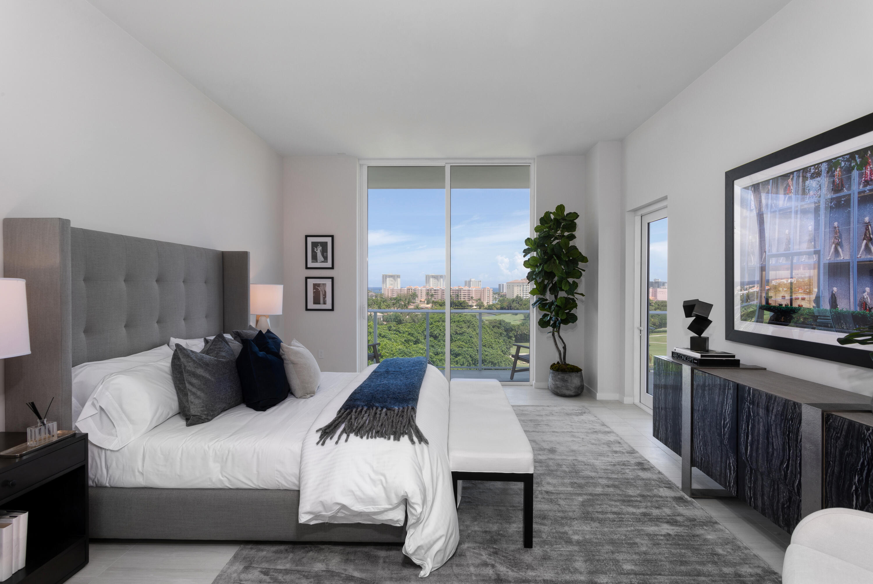 200 Southeast Mizner Boulevard, Unit PH18 Boca Raton, FL 33432 - Photo 35 of 49 a bedroom with a bed window and couch