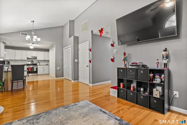 a living room with lots of furniture and flat screen tv