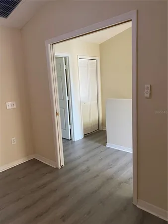 a view of a small space with wooden floor