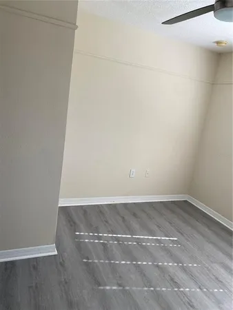 an empty room with wooden floor