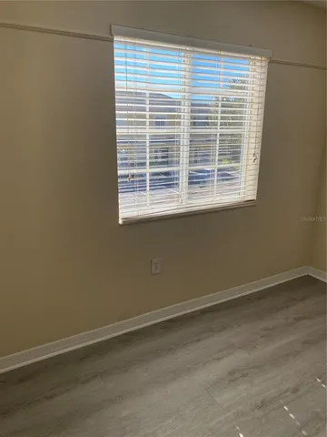 a view of a room that has a window in it