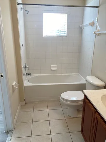 a bathroom with a bathtub toilet and sink