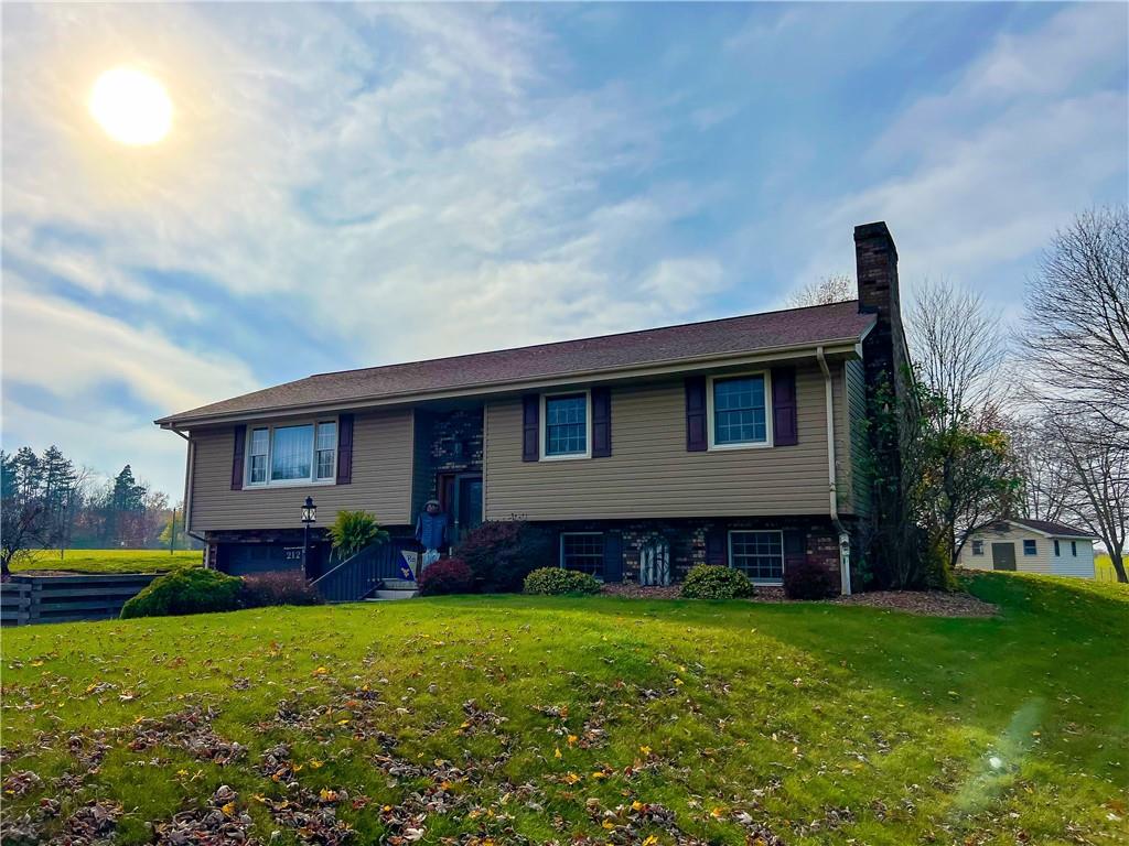 212 Meridian Road Butler, PA 16001 - Photo 1 of 25 a house view with a garden space