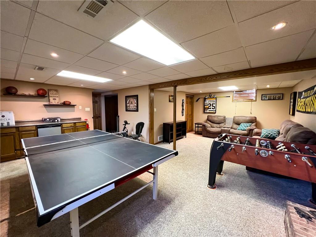 212 Meridian Road Butler, PA 16001 - Photo 16 of 25 a living room with furniture gym equipment and a view of kitchen