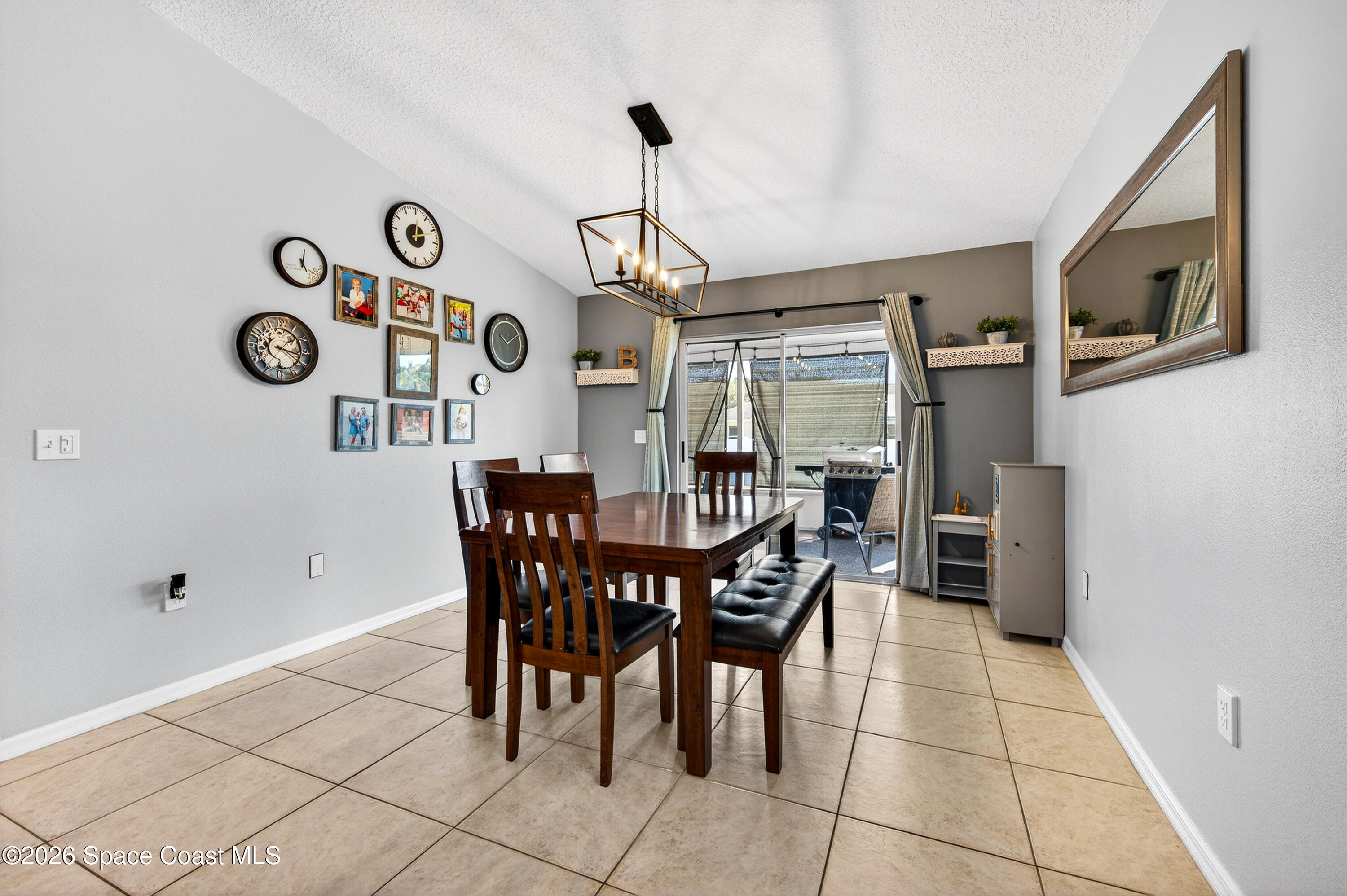 3393 Echo Ridge Place Cocoa, FL 32926 - Photo 19 of 40 a dining room with furniture and a window