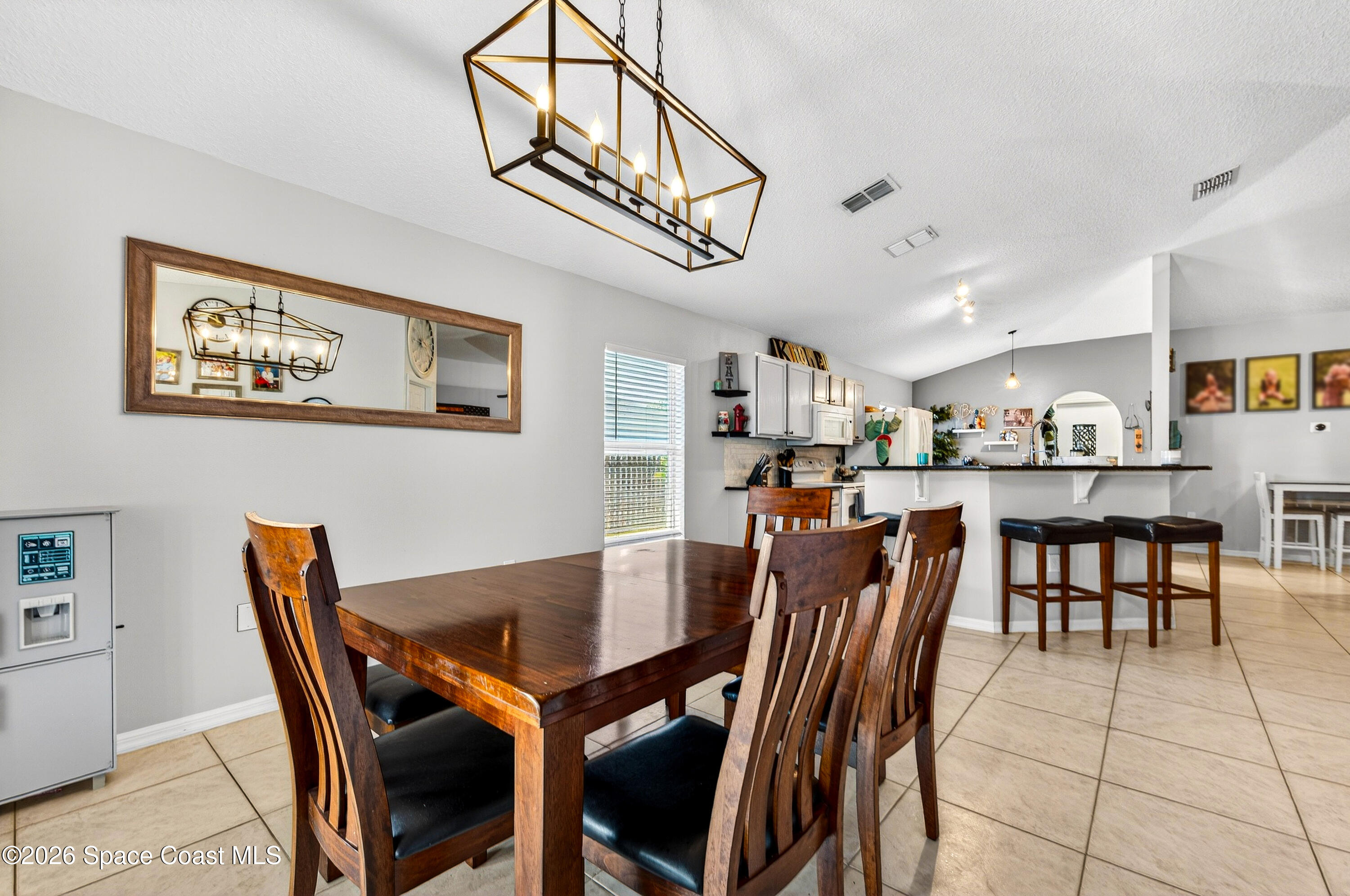 3393 Echo Ridge Place Cocoa, FL 32926 - Photo 21 of 40 a view of a dining room with furniture
