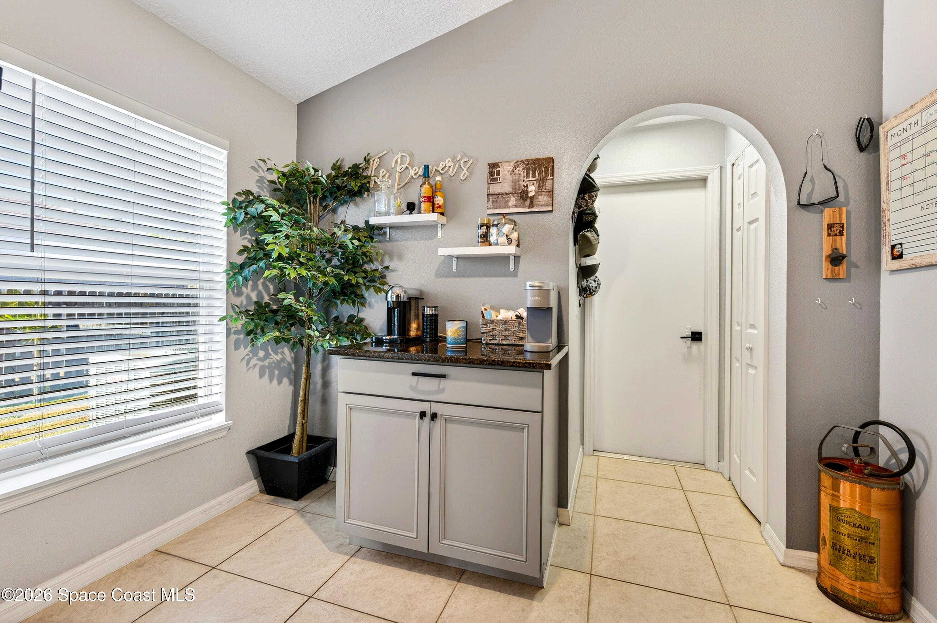 3393 Echo Ridge Place Cocoa, FL 32926 - Photo 24 of 40 a room with window and potted plant