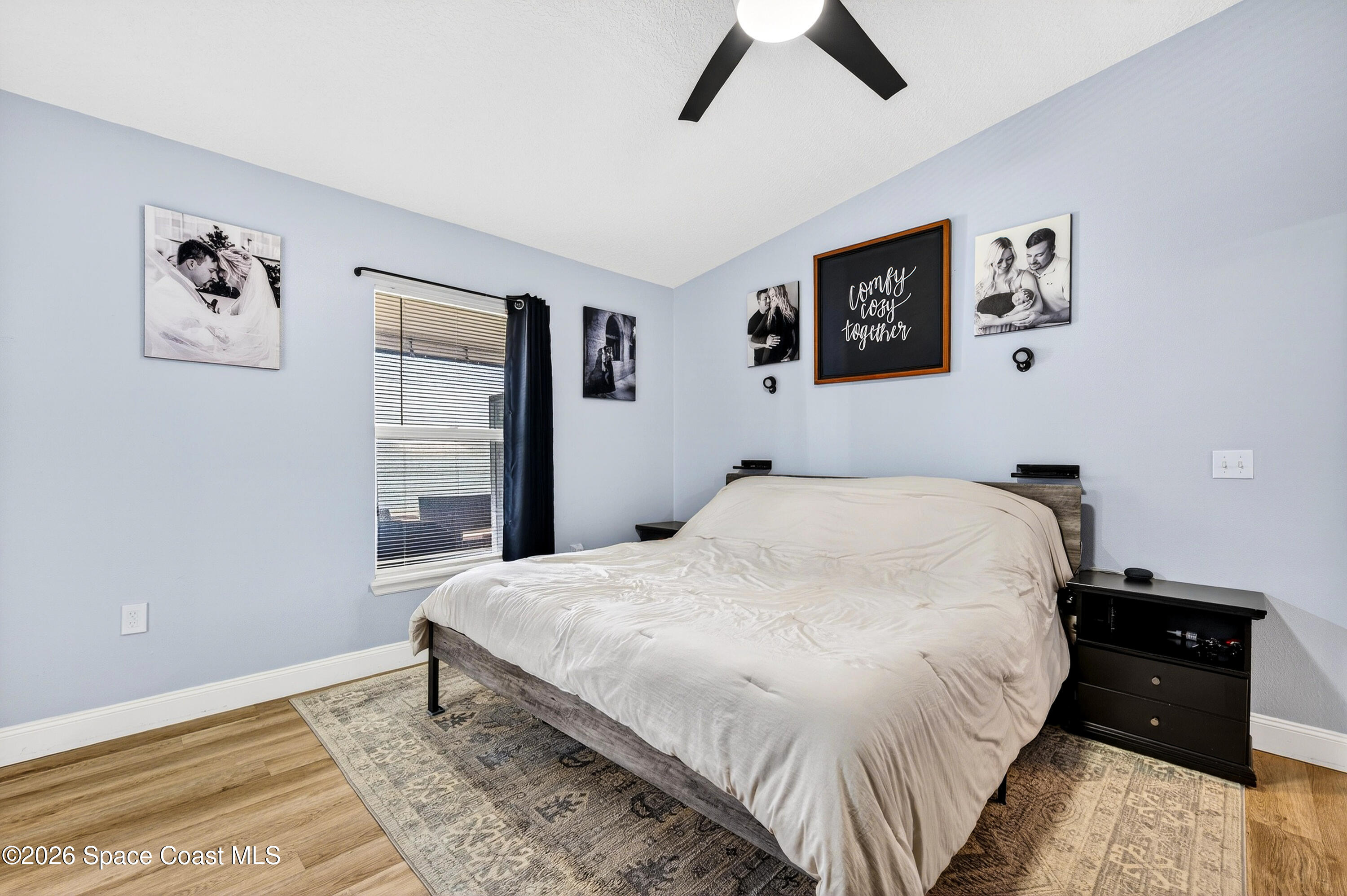 3393 Echo Ridge Place Cocoa, FL 32926 - Photo 26 of 40 a bed room with a bed and a night stand