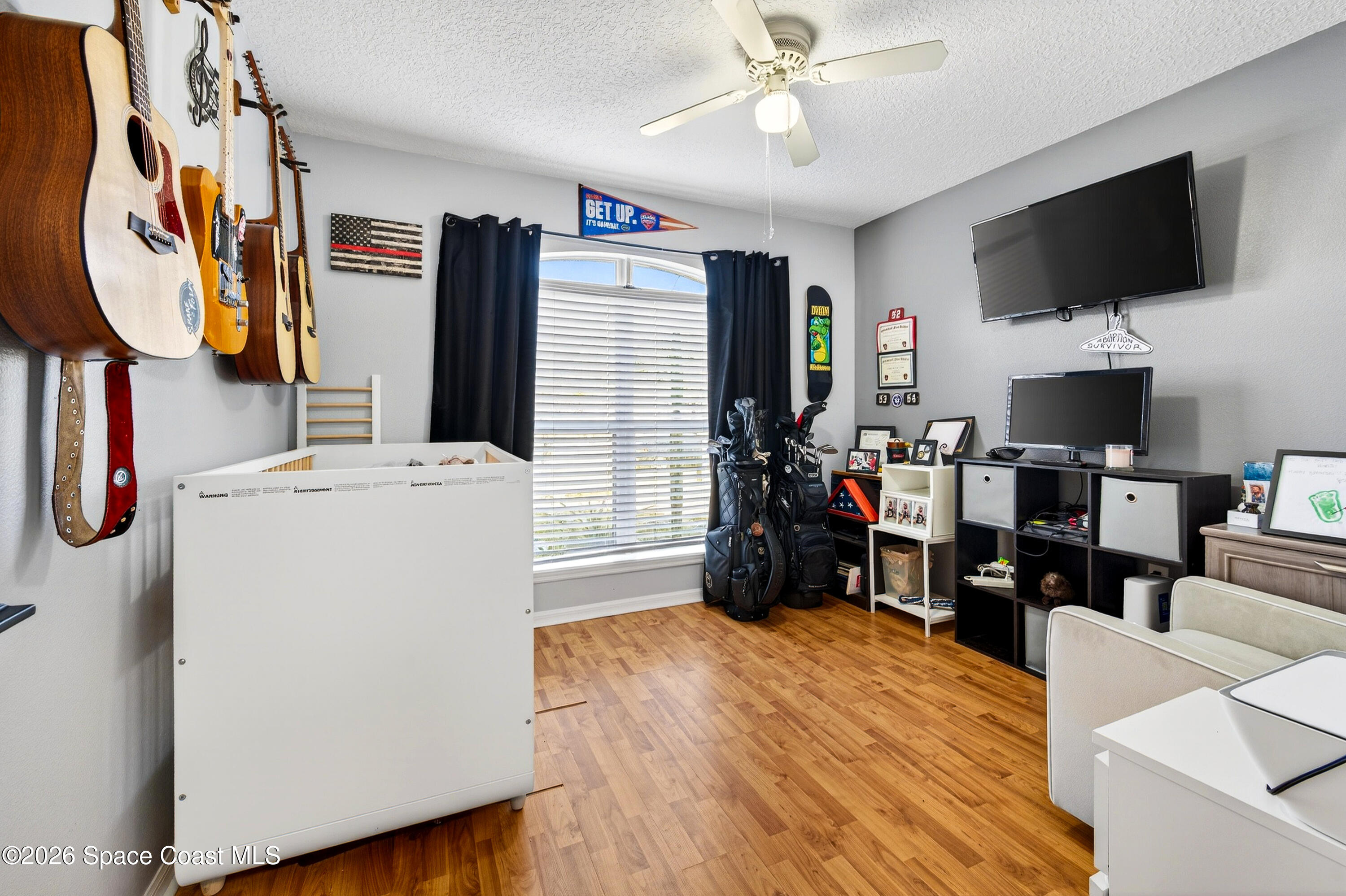 3393 Echo Ridge Place Cocoa, FL 32926 - Photo 33 of 40 a view of a living room with furniture and a flat screen tv