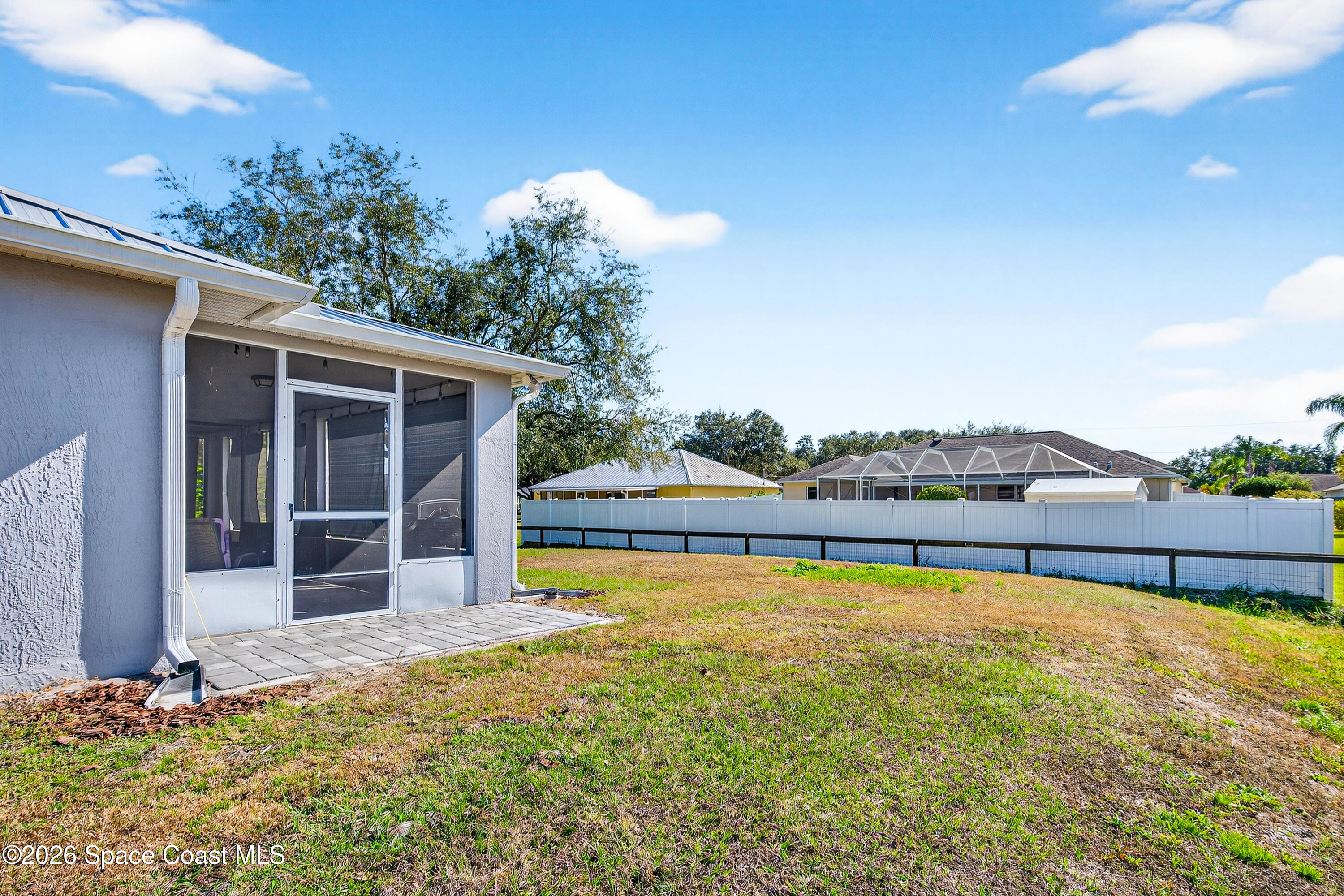 3393 Echo Ridge Place Cocoa, FL 32926 - Photo 37 of 40 a swimming pool with an outdoor seating and yard