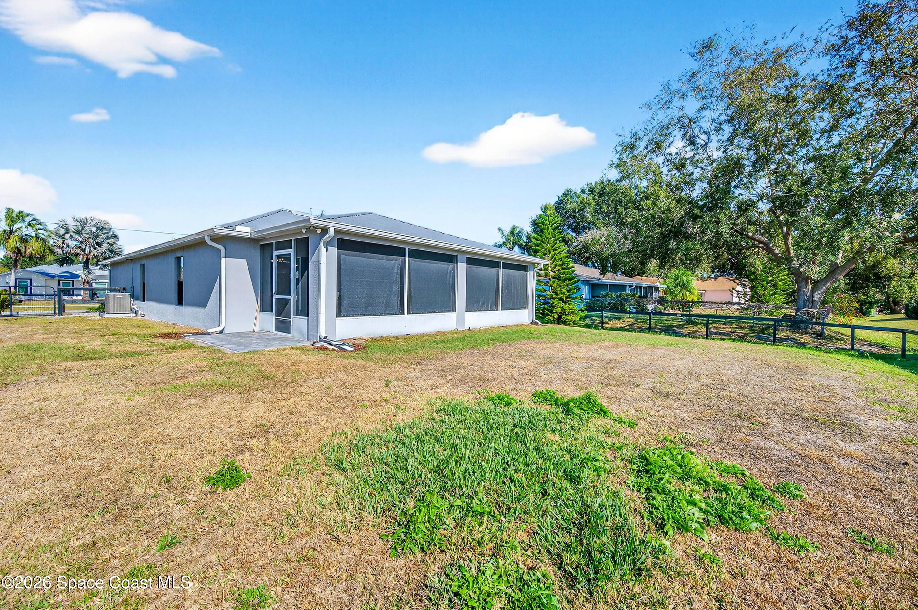 3393 Echo Ridge Place Cocoa, FL 32926 - Photo 38 of 40 a view of a house with a yard
