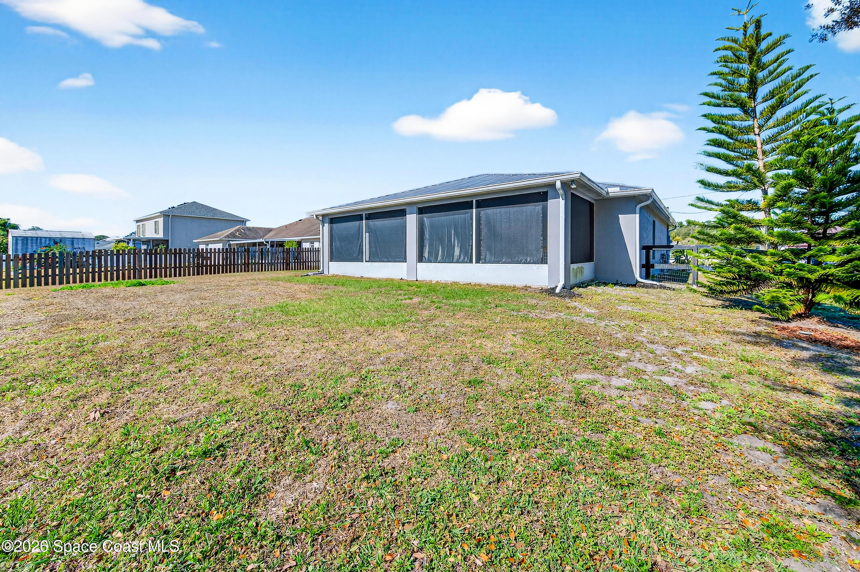 3393 Echo Ridge Place Cocoa, FL 32926 - Photo 39 of 40 a view of a house with a yard