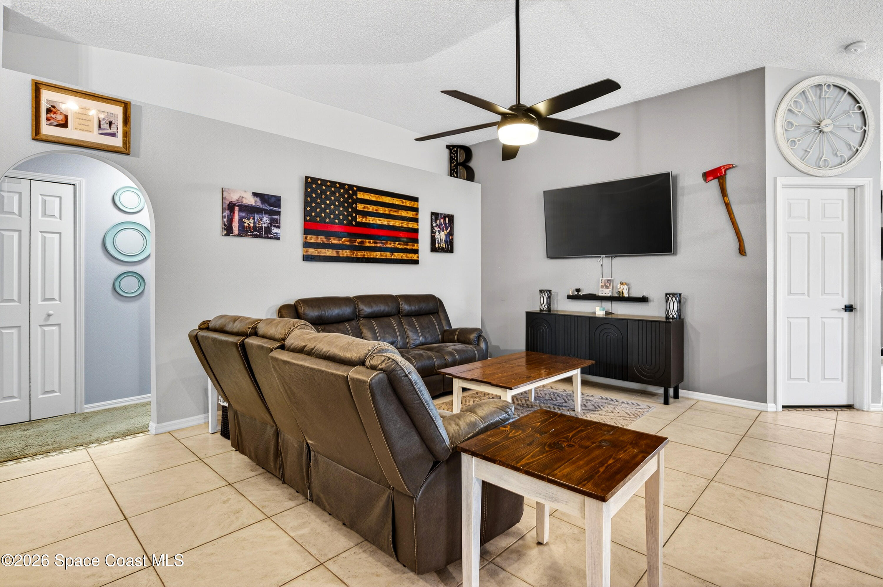 3393 Echo Ridge Place Cocoa, FL 32926 - Photo 10 of 40 a work room with furniture and a flat screen tv