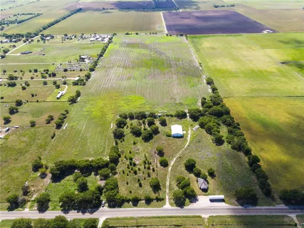 a view of a big yard with an outdoor space