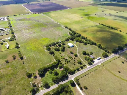 a view of a swimming pool with a yard