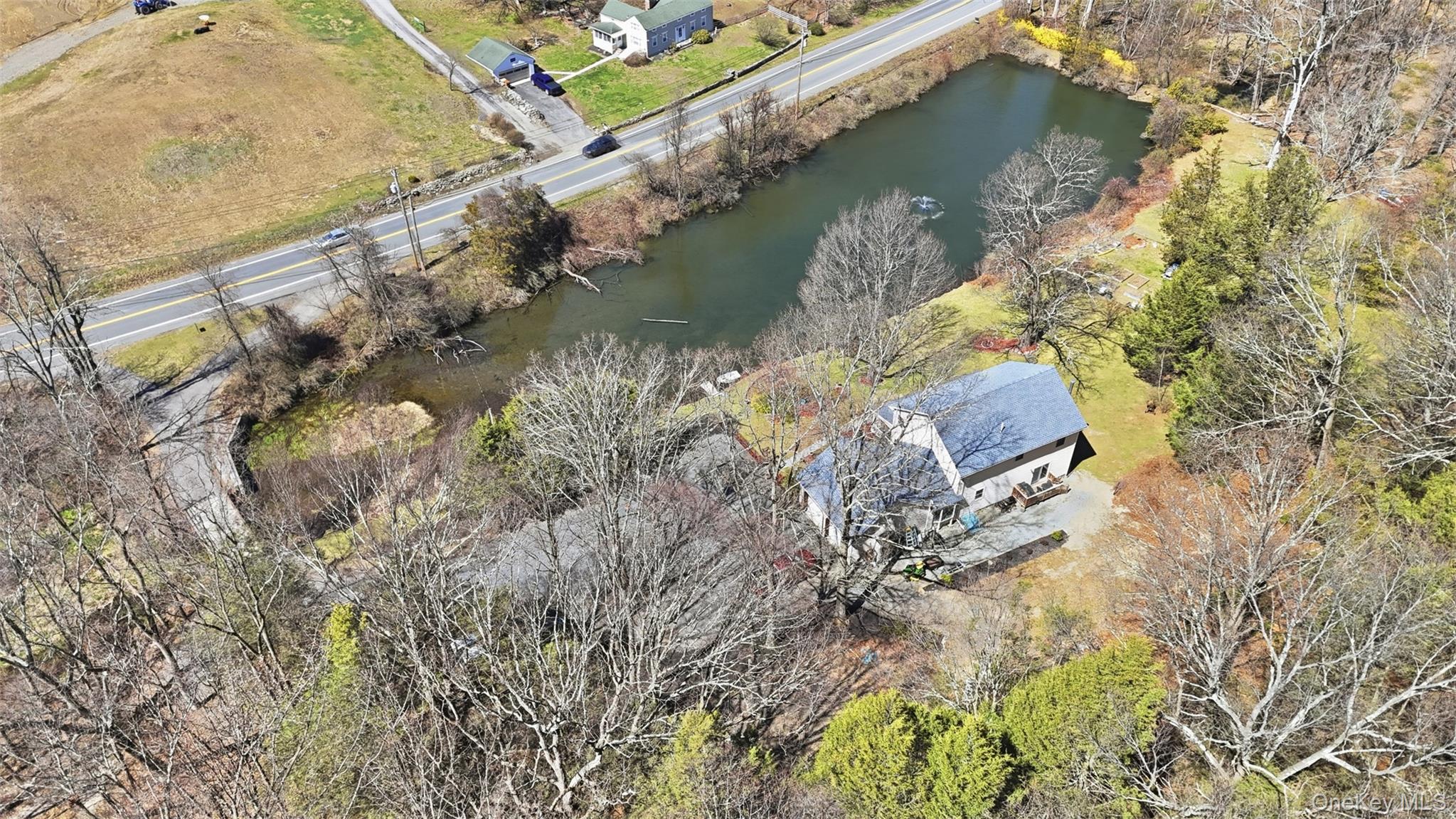 1285 Lakes Road Monroe, NY 10950 - Photo 33 of 45 a aerial view of a house with a yard and a large tree