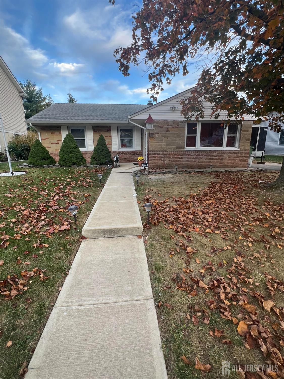 11 Gurley Road Edison, NJ 08817 - Photo 1 of 24 a front view of a house with a garden
