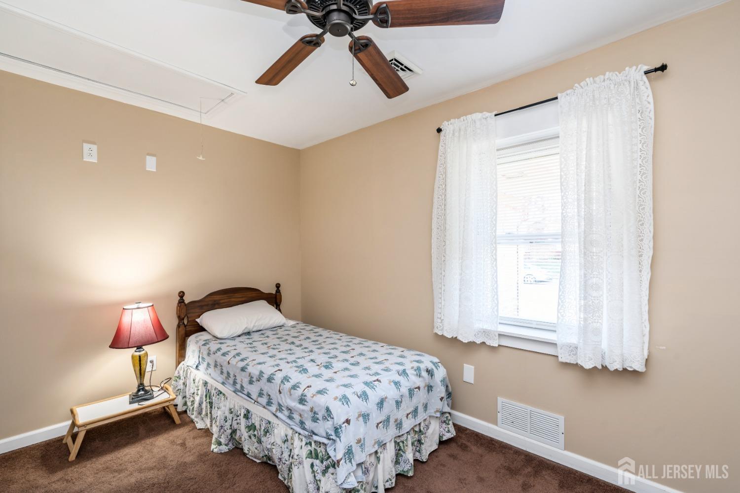 11 Gurley Road Edison, NJ 08817 - Photo 8 of 24 a bedroom with a bed and a window