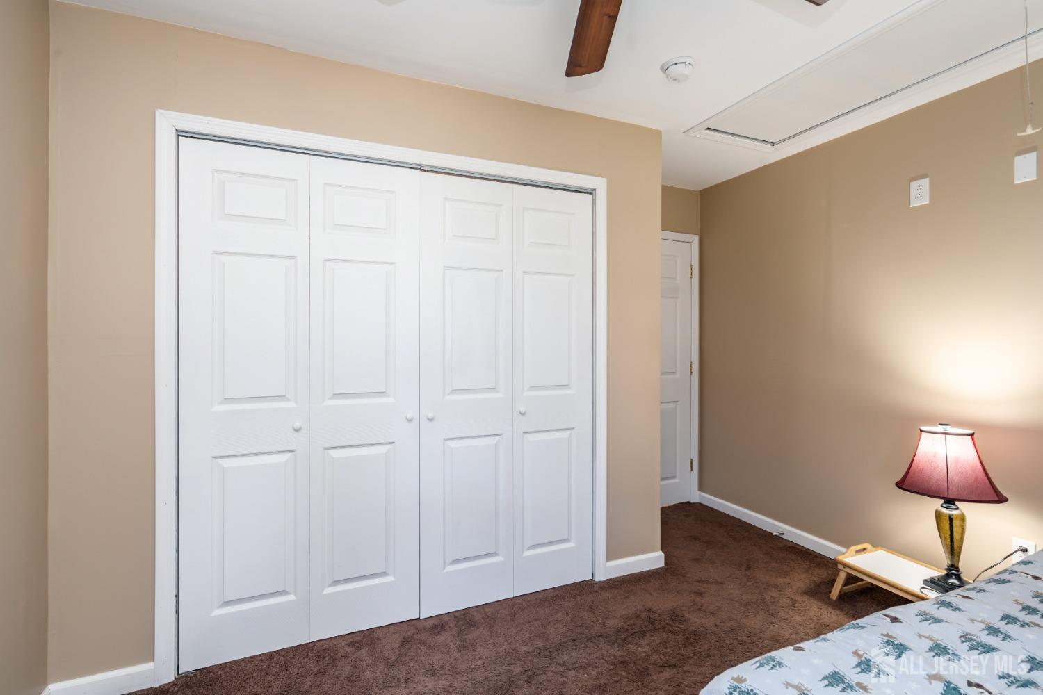 11 Gurley Road Edison, NJ 08817 - Photo 9 of 24 a bedroom with a bed and a lamp