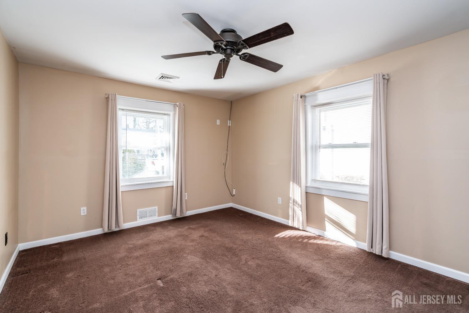 11 Gurley Road Edison, NJ 08817 - Photo 10 of 24 an empty room with fan and windows
