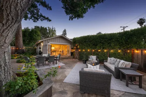 a view of a tables and chairs in a patio