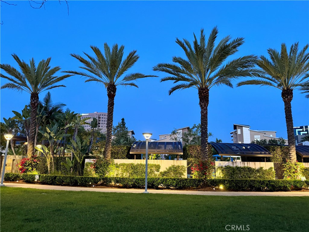 21 Gramercy, Unit 102 Irvine, CA 92612 - Photo 28 of 30 Lush palm lined community grounds creating a true Southern California resort atmosphere.