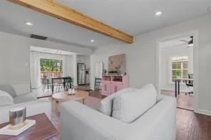 a living room with furniture and a table