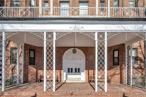 a front view of a house with large windows