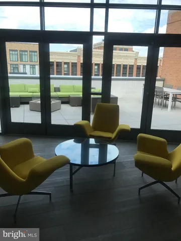 a kitchen with a table chairs and a window