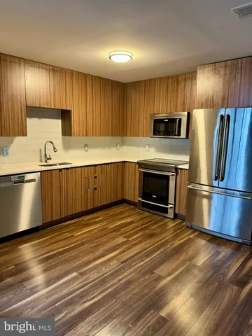 a close view of a utility room with dryer and washer