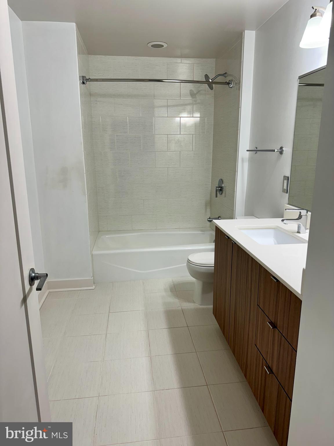 460 New York Avenue Northwest, Unit 407 Washington, DC 20001 - Photo 39 of 64 a bathroom with a sink a toilet and shower