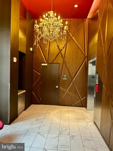 a bathroom with a mirror and a shower