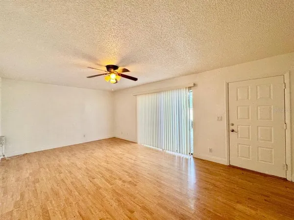 a view of a livingroom with wooden floor