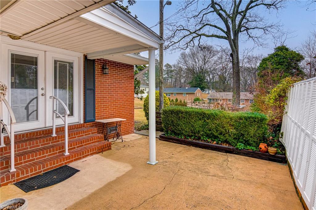 1314 Florida Street High Point, NC 27262 - Photo 29 of 36 Patio and rear entrance to the den