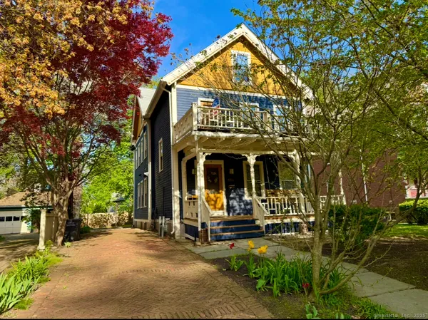 front view of a building with a garden