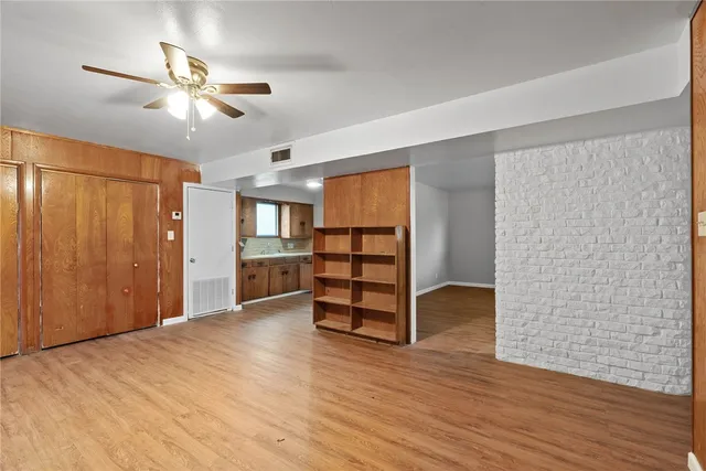 a view of a room with wooden floor and closet