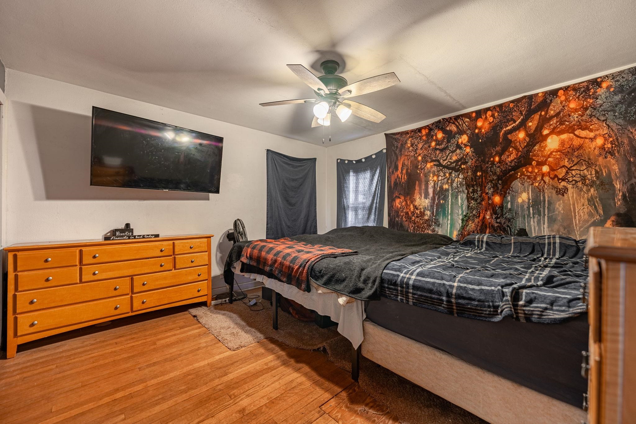 1924 North Alpine Road Rockford, IL 61107 - Photo 17 of 20 a bedroom with a bed and a flat screen tv
