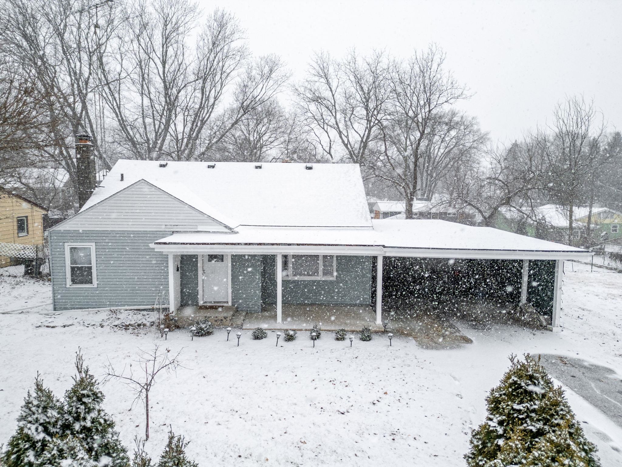 1924 North Alpine Road Rockford, IL 61107 - Photo 2 of 20 a backyard of a house with table and chairs under an umbrella