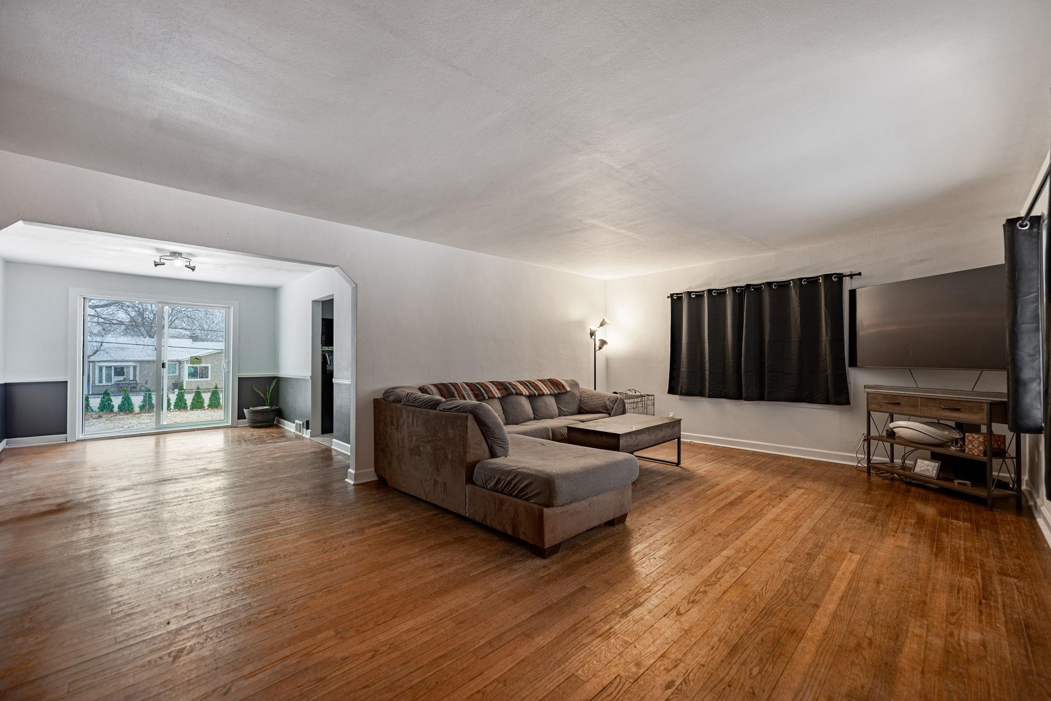 1924 North Alpine Road Rockford, IL 61107 - Photo 7 of 20 a living room with furniture flat screen tv and wooden floor