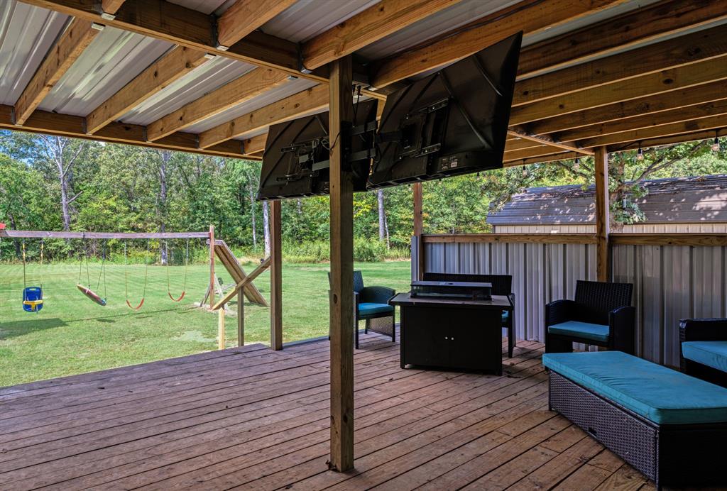 28 Private Road Sumner, TX 75486 - Photo 13 of 17 Wooden terrace featuring a playground
